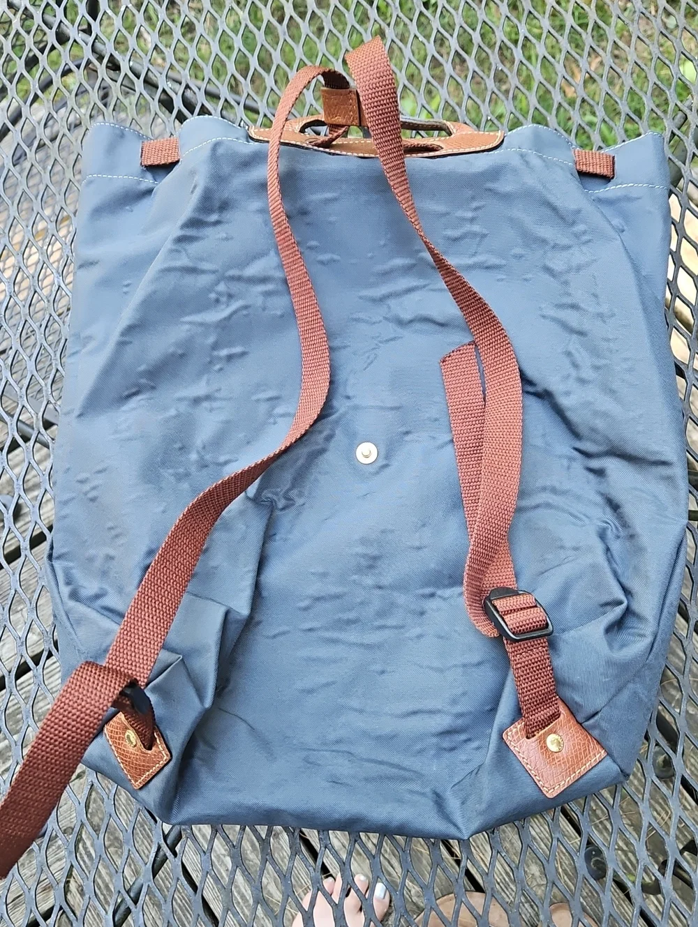Longchamp navy nylon backpack with brown leather flap